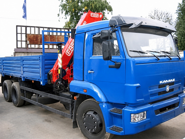 Фото №1: Бортовой КАМАЗ 65117 с КМУ Fassi F155A 0.22